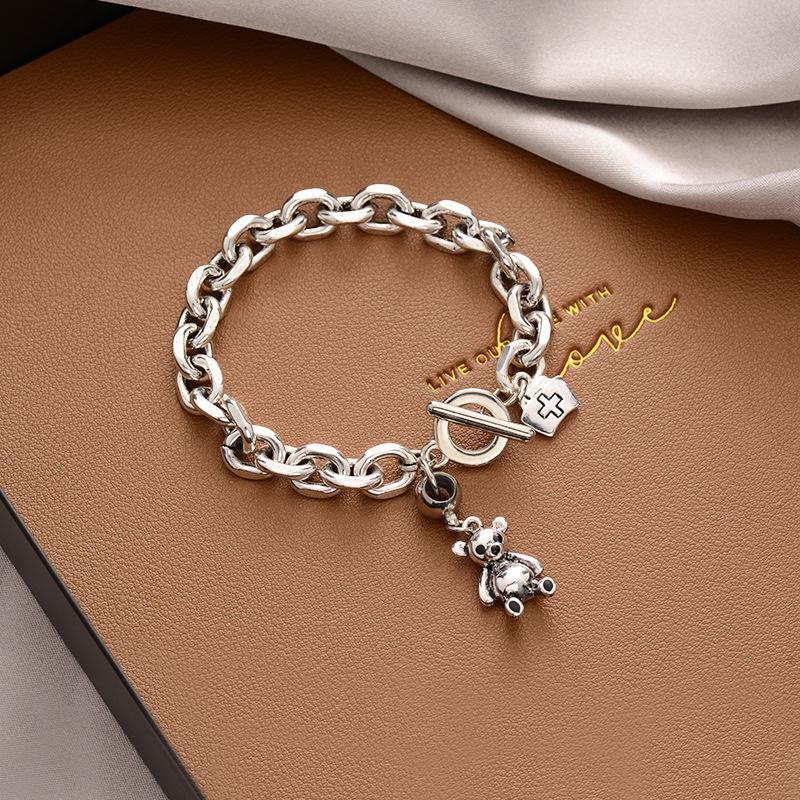 Stylish Silver - toned Chain Bracelet with Teddy - bear and Cross - emblem Charms