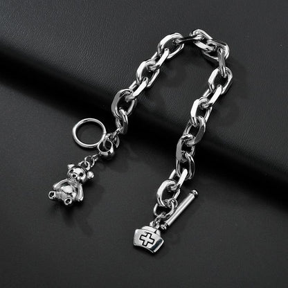 Stylish Silver - toned Chain Bracelet with Teddy - bear and Cross - emblem Charms