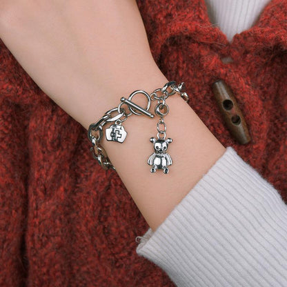 Stylish Silver - toned Chain Bracelet with Teddy - bear and Cross - emblem Charms