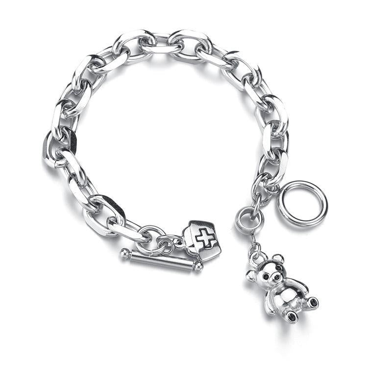 Stylish Silver - toned Chain Bracelet with Teddy - bear and Cross - emblem Charms