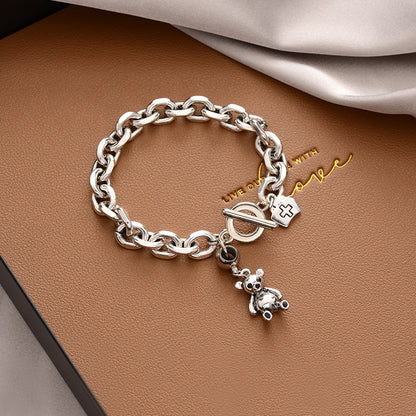 Stylish Silver - toned Chain Bracelet with Teddy - bear and Cross - emblem Charms